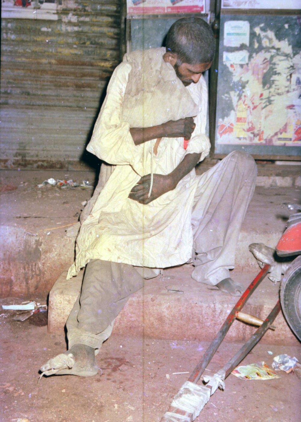 A man rests alone on a roadside kerb at night, one of the many vulnerable people the team encountered. A man rests alone on a roadside kerb at night, one of the many vulnerable people the team encountered.